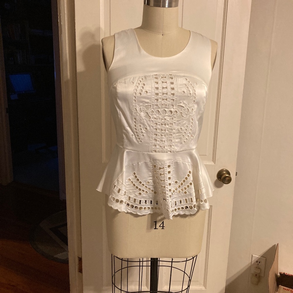 White Embroidered peplum satin top